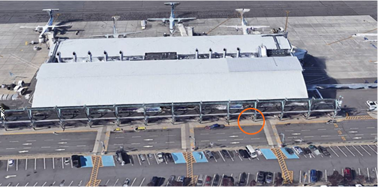 Aerial view of Thunder Bay Airport indicating where the curbside assistance area is, just after the first speed bump